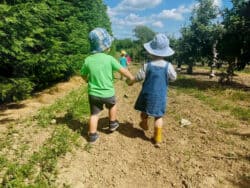 Children walking hand in hand at Juniors Day Nursery.