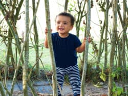 Toddler playing in the garden at Juniors Day Nursery.