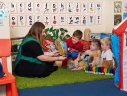 Story time, children reading at Juniors Day Nursery.