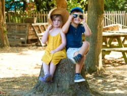 Pre-school children playing in the garden at Juniors Day Nursery.